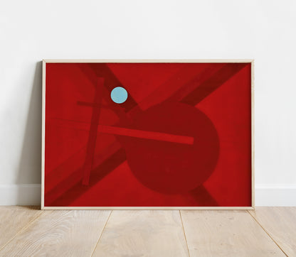 Framed abstract artwork with a red background and blue circle on a white wall.