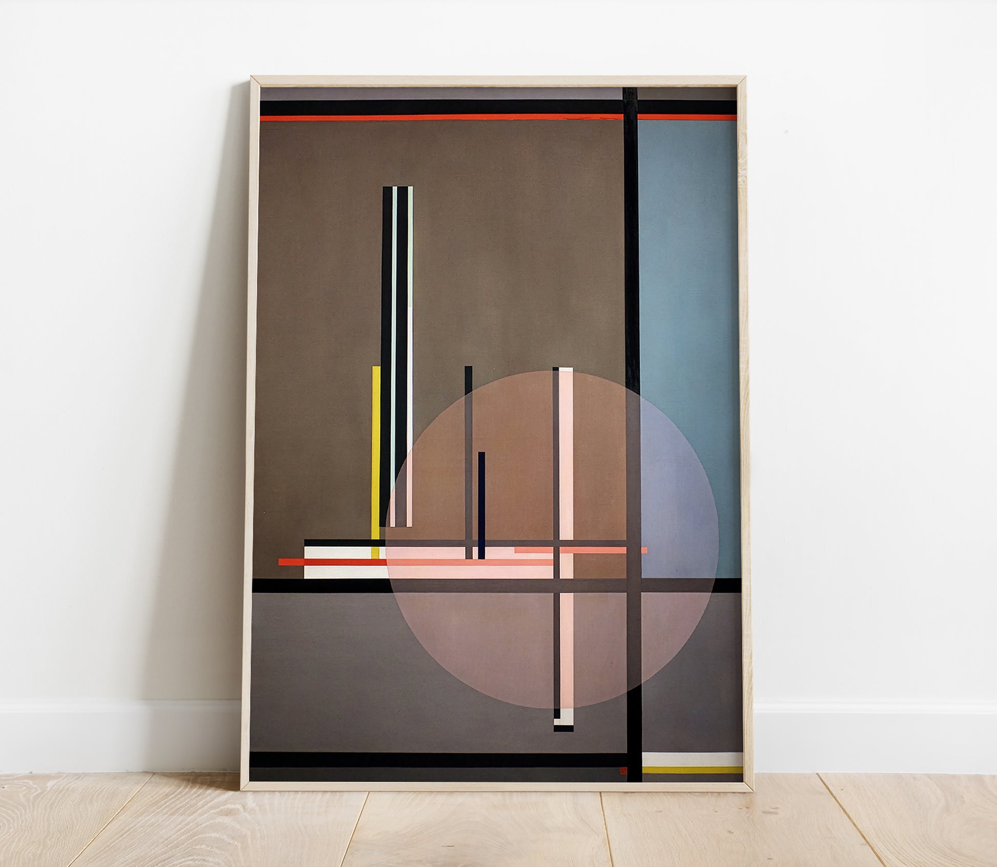 Abstract art print in a frame on a white wall