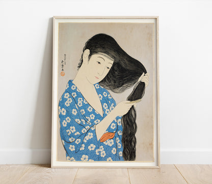 Preview of the art print Woman Combing Hair by Goyo Hashiguchi, mounted in a poster frame